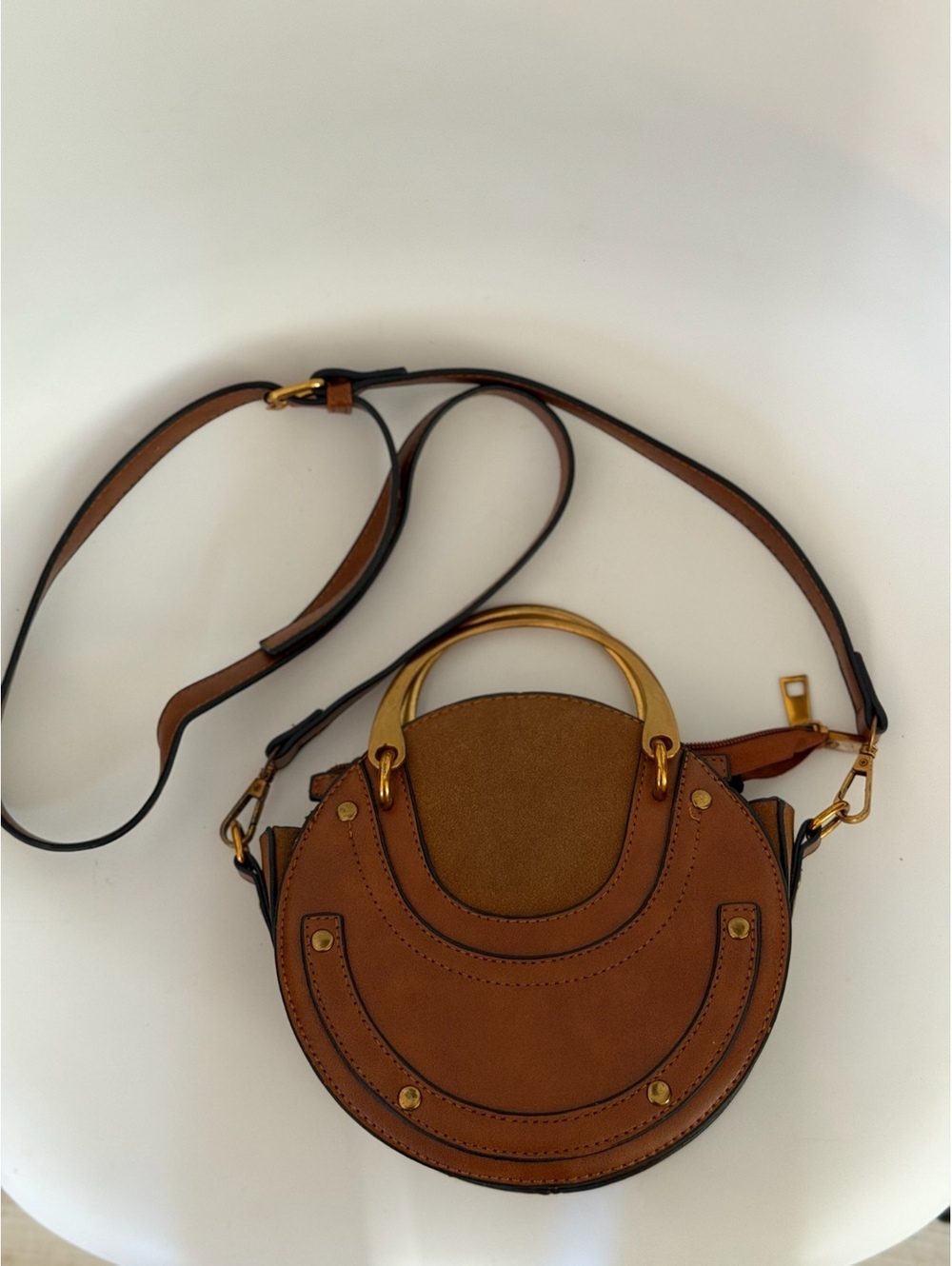 Brown round crossbody bag